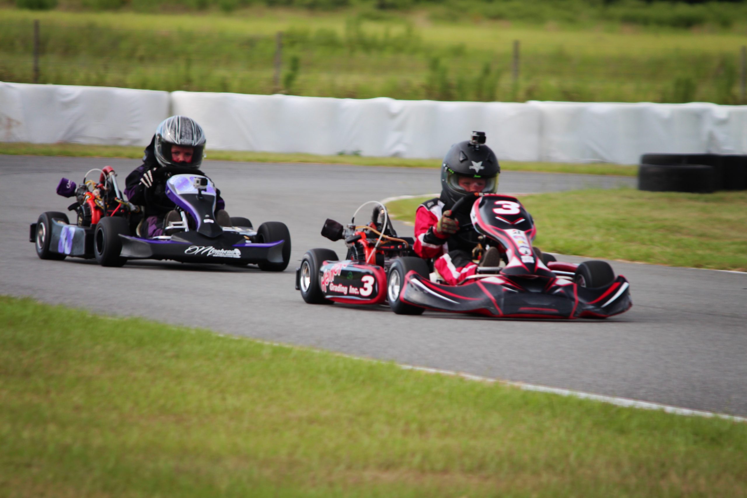 Jace Henley and Darryl Moglia racing their K2 Ignite Karts with custom graphics at BMP's Local Race Series